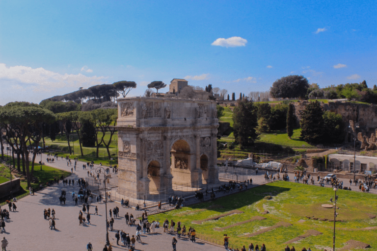 A stunning view of the Arc de Triomphe in Rome one go the Best Vacation Spots in Italy, a majestic historical monument adorned with intricate carvings and sculptures.
