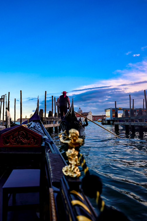Scenic gondola ride through the iconic canals of Venice, Italy, one Best Vacation Spots in Italy with historical architecture in the background