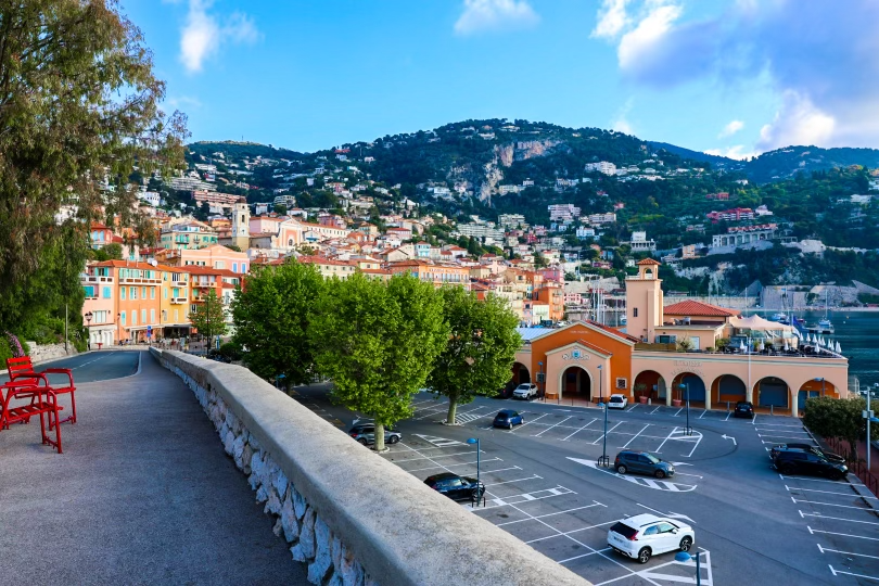Scenic view of Villefranche Sur Mer, France, with its colorful buildings nestled against the turquoise Mediterranean Sea, capturing the beauty of the coastal town